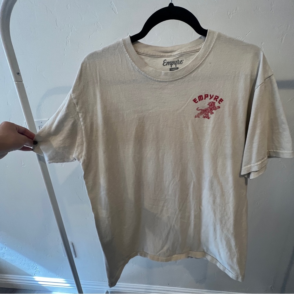Cream shirt with red design